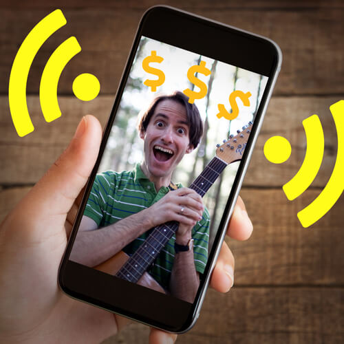 hand holding I-Phone with graphic indicating it's making sound. On phone is actor with open-mouthed look of excitement and 3 dollar signs floating over his head